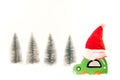 Christmas red jat on wood toy car on the snow. Royalty Free Stock Photo