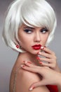 Christmas red lips makeup and Manicured nails. Beautiful blonde Royalty Free Stock Photo