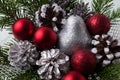 Christmas red ornaments, silver pine cones and glitter pear Royalty Free Stock Photo