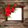 Christmas red poinsettia flowers corner arrangement with ribbon Royalty Free Stock Photo