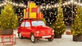 Christmas red retro car with gift boxes on the roof close up against the background of the night sky with bokeh. Vintage red truck Royalty Free Stock Photo