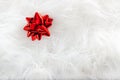 Christmas red ribbon look over white fur Royalty Free Stock Photo