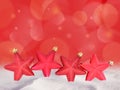 Christmas red stars decorations and bokeh background Royalty Free Stock Photo