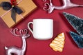 Christmas red theme product mockup with pink reindeers, gift, cookies and trees. Royalty Free Stock Photo