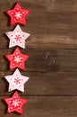 Christmas red and white stars on wooden background Royalty Free Stock Photo