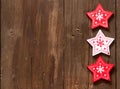 Christmas red and white stars on wooden background Royalty Free Stock Photo