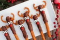 Christmas reindeer pretzel rods above on a serving plate