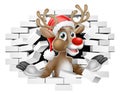Christmas Reindeer in Santa Hat Breaking Wall Royalty Free Stock Photo