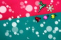 Christmas reindeer snowflake fruits and bell on Red green background with snow fall,top view with copy space Royalty Free Stock Photo