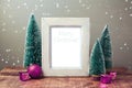 Christmas retro poster mock up with pine trees and pink decorations