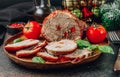 Christmas roasted pork meat for Christmas Holiday dinner on dark background.