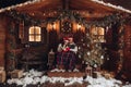 Christmas romance in Santa Claus hats beautiful house New Year`s atmosphere