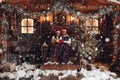 Christmas romance in Santa Claus hats beautiful house New Year`s atmosphere