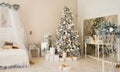 Christmas Room Interior Design, Xmas Tree Decorated By Lights Presents Gifts Toys white and gold, Candles And Garland, mirror Royalty Free Stock Photo