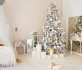 Christmas Room Interior Design, Xmas Tree Decorated By Lights Presents Gifts Toys white and gold, Candles And Garland, mirror Royalty Free Stock Photo