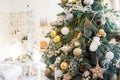 Christmas Room Interior Design, Xmas Tree Decorated By Lights Presents Gifts Toys white and gold, Candles And Garland, mirror Royalty Free Stock Photo