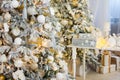 Christmas Room Interior Design, Xmas Tree Decorated By Lights Presents Gifts Toys white and gold, Candles And Garland, mirror Royalty Free Stock Photo