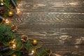 Christmas rustic background - old wooden board with backlight and branches of a Christmas tree and shyshkami and a free text space Royalty Free Stock Photo