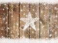 Christmas background with snowflakes on wooden board with snow star in winter Royalty Free Stock Photo
