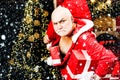 Christmas safety from burglars and home security. Funny bad Santa Claus with gift, bag with presents. Criminal christmas