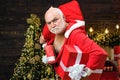 Christmas safety from burglars and home security. Holiday crime scene with bad Santa in the mask with bag.