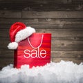 Christmas - Sale bag , rebate ,on wood background Royalty Free Stock Photo