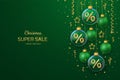 Christmas sale banner design. Golden 3D Percentage symbol in a transparent glass ball. Green background with hanging gold stars, Royalty Free Stock Photo