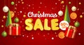 Christmas Sale banner red with composition made of hanging christmass ball and plastic green cartoon Christmas trees Royalty Free Stock Photo