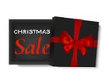 Christmas sale design. Opened black realistic 3d gift box with red ribbon and bow isolated on white background. Royalty Free Stock Photo