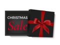 Christmas sale design. Opened black realistic 3d gift box with red ribbon and bow isolated on white background. Royalty Free Stock Photo