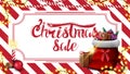 Christmas sale, discount banner with red and white striped texture on the background and Santa Claus bag with presents