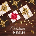 Christmas sale with gift boxes and gold bow . Happy New Year decoration with confetti and light garland. Christmas Royalty Free Stock Photo