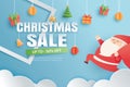 Christmas sale with gifts and elements hanging on red background banner in paper art style Royalty Free Stock Photo