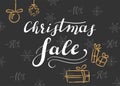 Christmas sale. Lettering on a dark background with snowflakes