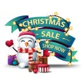 Christmas sale, shop now, discount banner in the form of green ribbons wrapped garland with snowman in Santa Claus hat with gifts