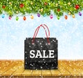 Christmas sale. Shoping paper bag on wood table top