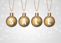 Christmas sale sign on golden baubles over white background Royalty Free Stock Photo