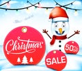 Christmas Sale with Snowman Character in Red Round Tag Royalty Free Stock Photo