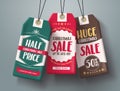 Christmas sale tags hanging vector set in different colors with huge sale and half price text Royalty Free Stock Photo