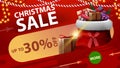 Christmas sale, up to 30% off, red discount banner with round green button, garlands and Santa Claus bag with presents Royalty Free Stock Photo