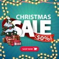 Christmas sale, up to 50% off, square blue discount banner with garlands, large letters, red ribbon, button and Christmas tree. Royalty Free Stock Photo