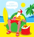 Christmas Santa on the beach with palm on some tropical island. Santa Claus with surfboard and gifts, christmas vacation Royalty Free Stock Photo