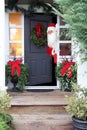 Christmas Santa Claus at the front door. Royalty Free Stock Photo