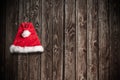 Christmas Santa Claus Hat Hanging On Wood Wall Royalty Free Stock Photo