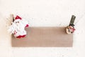 Christmas Santa Claus and snowman clothespin holding craft paper Royalty Free Stock Photo