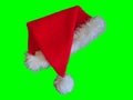 Christmas Santa Hat Isolated on Green Background 1 Royalty Free Stock Photo