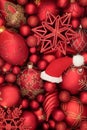 Christmas Santa Hat and Red and Gold Bauble Background Royalty Free Stock Photo