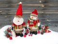 christmas santa snowman decoration winter berries and snow on wooden background Royalty Free Stock Photo