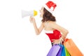 Christmas santa woman using a megaphone with gift bags Royalty Free Stock Photo