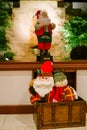 Christmas santas in a chest under a window Royalty Free Stock Photo